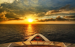 white ship on body of water under yellow sunset HD wallpaper